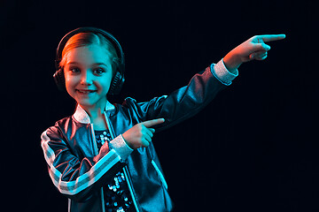 Image showing Young girl with headphones enjoying music