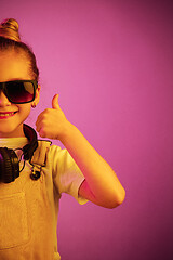 Image showing Young girl with headphones enjoying music