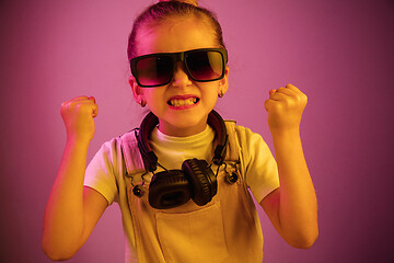 Image showing Young girl with headphones enjoying music