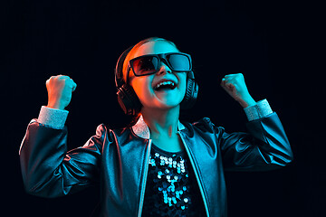 Image showing Young girl with headphones enjoying music