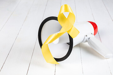 Image showing Yellow ribbon symbolic color for Sarcoma Bone cancer awareness and suicide prevention