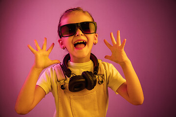 Image showing Young girl with headphones enjoying music