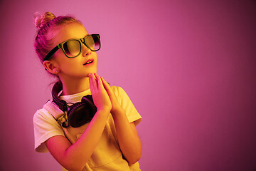 Image showing Young girl with headphones enjoying music