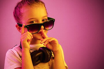 Image showing Young girl with headphones enjoying music