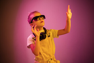 Image showing Young girl with headphones enjoying music