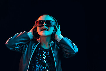 Image showing Young girl with headphones enjoying music