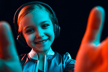 Image showing Young girl with headphones enjoying music