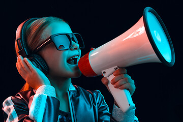 Image showing Young girl with headphones enjoying music