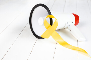 Image showing Yellow ribbon symbolic color for Sarcoma Bone cancer awareness and suicide prevention