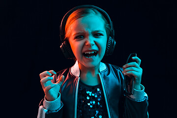 Image showing Young girl with headphones enjoying music