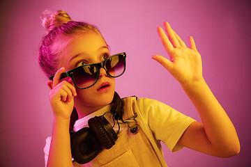 Image showing Young girl with headphones enjoying music