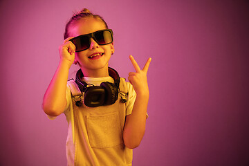 Image showing Young girl with headphones enjoying music