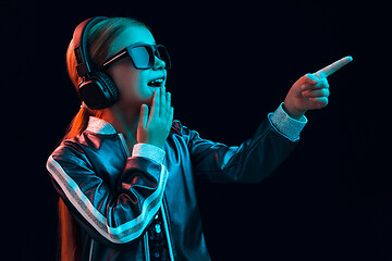 Image showing Young girl with headphones enjoying music