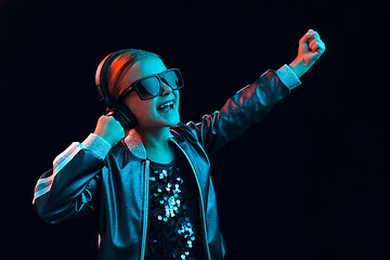 Image showing Young girl with headphones enjoying music