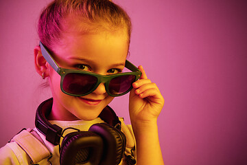 Image showing Young girl with headphones enjoying music