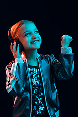 Image showing Young girl with headphones enjoying music