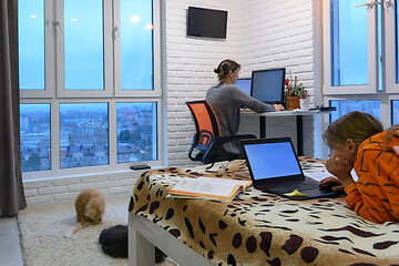 Image showing remote work and home-based training in a living room at computers