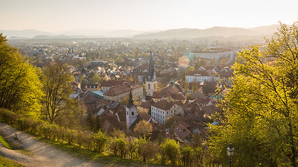 Image showing Panoramic view of Ljubljana, capital of Slovenia. Roooftops of Ljubljanas old medieval city center seen from Ljubljanas castle park at sunset