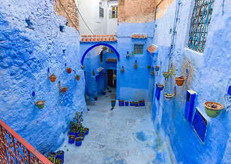Image showing Blue street with color pots in Chefchaouen