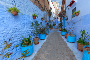 Image showing Blue street with color pots in Chefchaouen