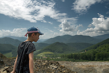 Image showing Boy throwing roks