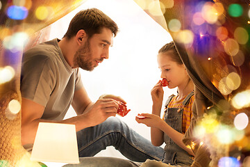 Image showing family playing tea party in kids tent at home