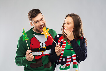 Image showing couple with christmas party props in ugly sweaters