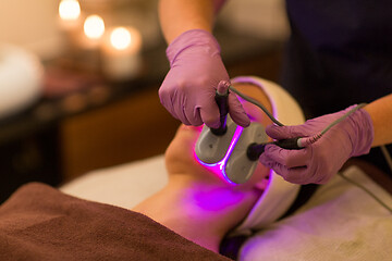 Image showing young woman having face microdermabrasion at spa