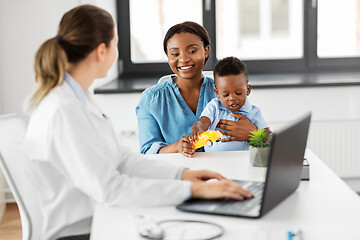 Image showing happy mother with baby son and doctor at clinic
