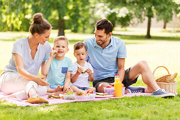 Image showing happy family having picnic at summer park