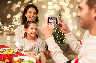 Image showing happy family taking picture at christmas dinner