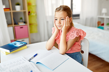 Image showing sad student girl with notebook at home