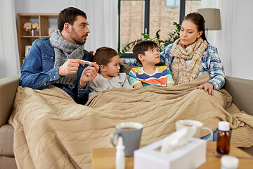 Image showing family with ill children having fever at home
