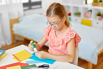 Image showing creative girl making greeting card at home