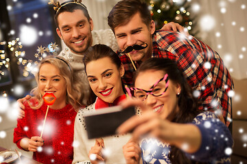 Image showing friends taking selfie at christmas dinner