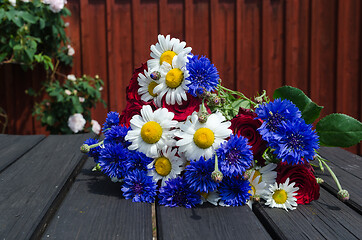 Image showing Summer flowers close up on a table