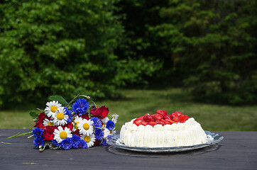 Image showing Summer flowers and cream cake