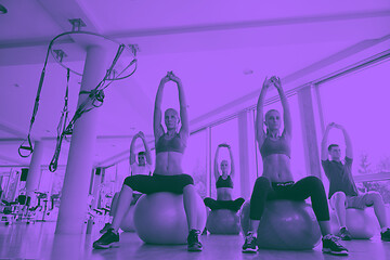 Image showing group of people exercise with balls on yoga class