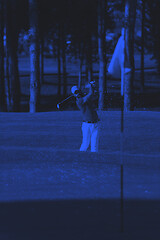 Image showing pro golfer hitting a sand bunker shot