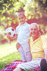 Image showing grandfather and child have fun  in park