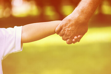 Image showing grandfather and child have fun  in park