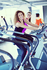 Image showing Group of people running on treadmills