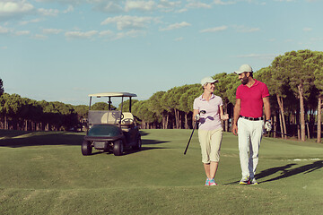 Image showing couple walking on golf course