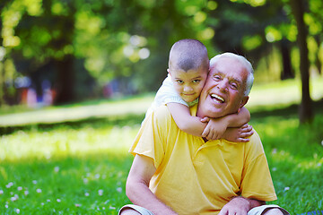 Image showing happy grandfather and child in park