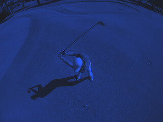 Image showing top view of golf player hitting shot