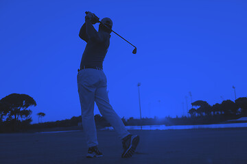 Image showing golfer hitting long shot