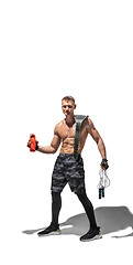 Image showing Beautiful young male athlete practicing on white studio background with shadows