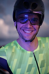 Image showing triathlon athlete portrait while resting on bike training