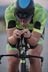 Image showing triathlon athlete riding a bike