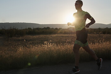 Image showing triathlon athlete running on morning trainig